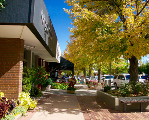 Outdoor shopping sidewalk and shops in Cherry Creek Denver.