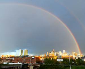 Rainbow over Downtown Denver skyline.