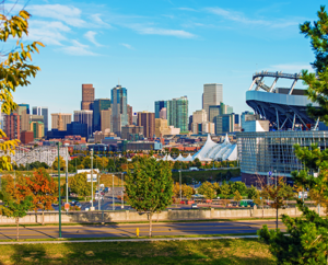 Downtown Denver city skyline and Sports Authority field.